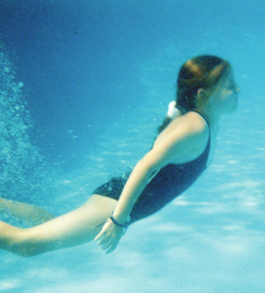 STAPLE HERE Cover Photo: A girl swims underwater in a swimming pool. 2005 by Reg Mckenna. Some rights reserved (http://creativecommons.org/licenses/by/2.0).