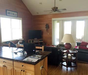5 BA apartment with full kitchen and screened porch are upstairs Attached are
