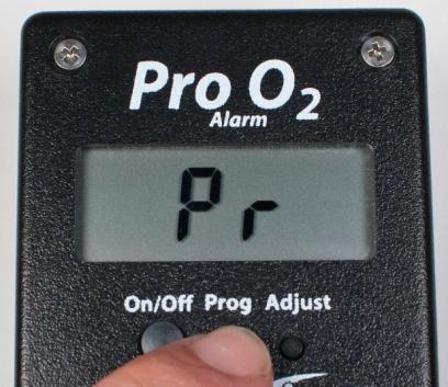B) Pro O 2 Keep the Prog button pressed for more than two seconds and then release the button.