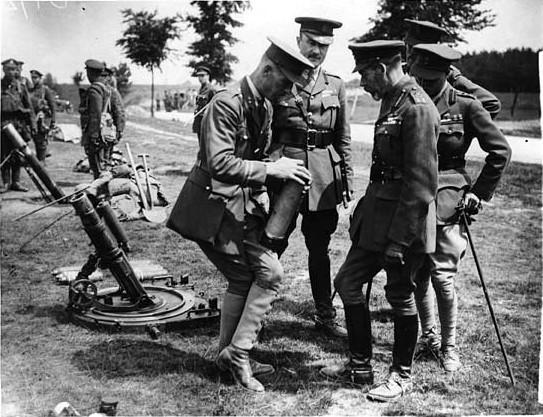 which describes the accident in which Hubert was killed. King George V inspecting a mortar exercise.