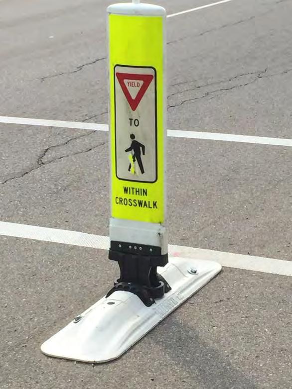 GATEWAY ELEMENTS A gateway treatment can be constructed from three types of elements 1 : A R1-6 sign mounted in the roadway on a curb types base, and a flexible delineator post mounted on the white