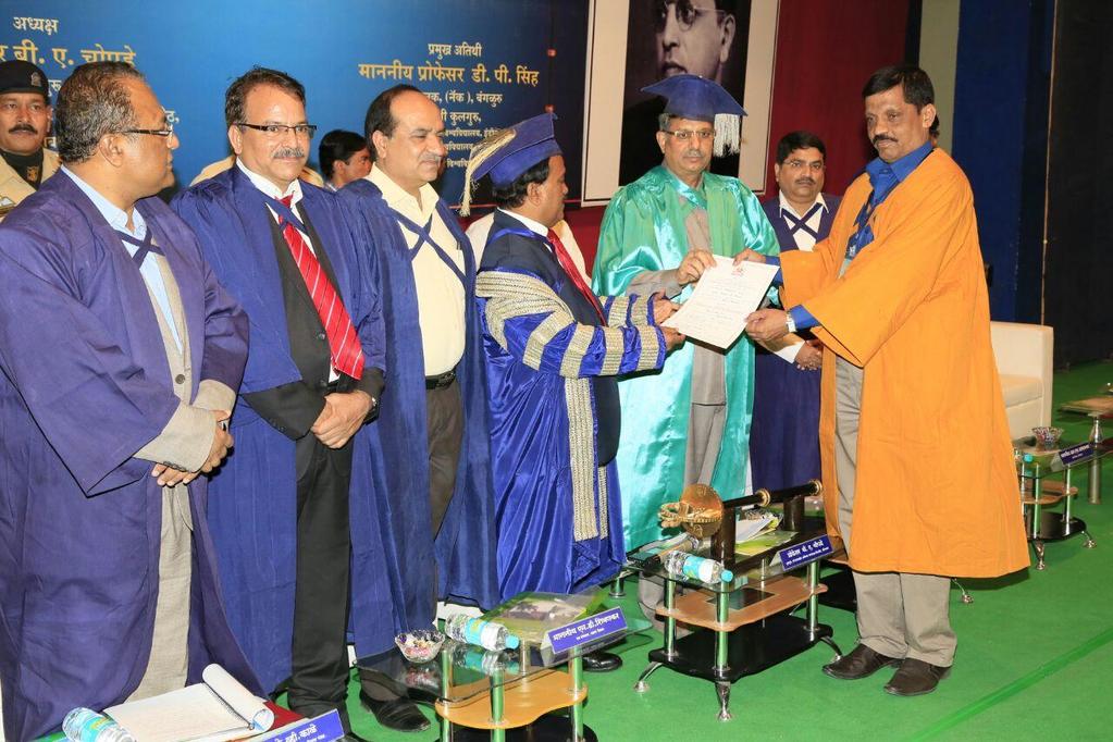 PHD. CONVOCATION CEREMONY AT DR.BABASAHEB AMBEDKAR MARATHWADA UNIVERSITY, AURANGABAD DR. NISAR HUSSAIN GETTING FELICITATED BY DR. D.P. SINGH HEAD AND DIRECTOR OF NAAC BANGLORE IN THE PRESENCE OF HONORABLE VICE CHANCELLOR PROF.