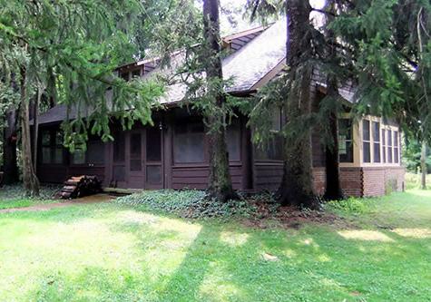 Facilities In the center of the property, at the end of the wellmaintained mile-long private drive, is a 6-bedroom, 2-bath rustic lodge.