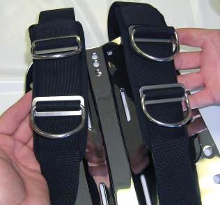 slides between each elastic slot to hold the shoulder pad in place (Fig. 7).