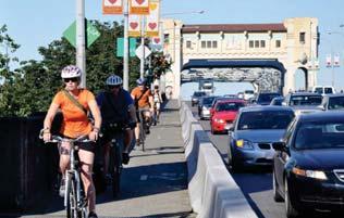 for everyone, including people walking, cycling, and driving Enable walking on both sides of the bridge (currently not permitted on east side) Improve walking and biking connections Maintain mor