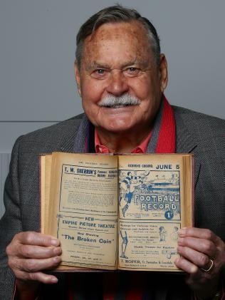 Ron Barassi with an old football record. Picture: Wayne Ludbey North Melbourne coach Ron Barassi circa 1980.