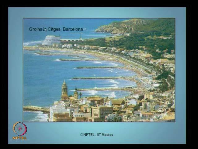 (Refer Slide Time: 27:13) So, this one of the interesting groin you see here, in Citges in Barcelona, these are all which are groins, which are constructed normal to the coast line.