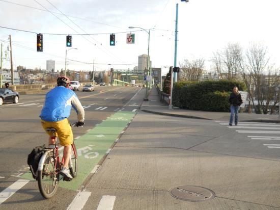 Bike Lane Extensions through Crossings Bicycle lane extensions delineate a safe and direct bicycle crossing through an intersection, or driveway, providing a clear boundary between the paths of