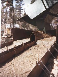 Once washed, the big boulders would roll down the front of the grizzly into a discard pile, and the gravel would drop down through the grates into the sluice.