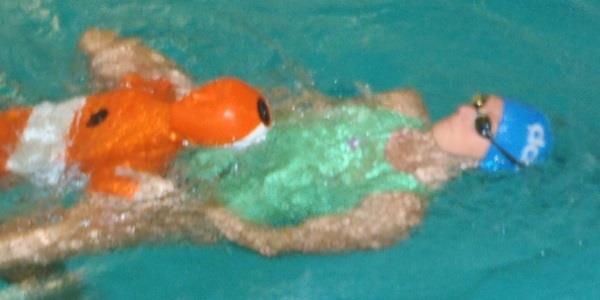 Double-hand underarm carry Competitors swim on their backs and may use any kick or stroke.