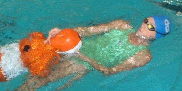 Single-hand chin carry Competitors swim on their back or side and may use any kick or stroke.