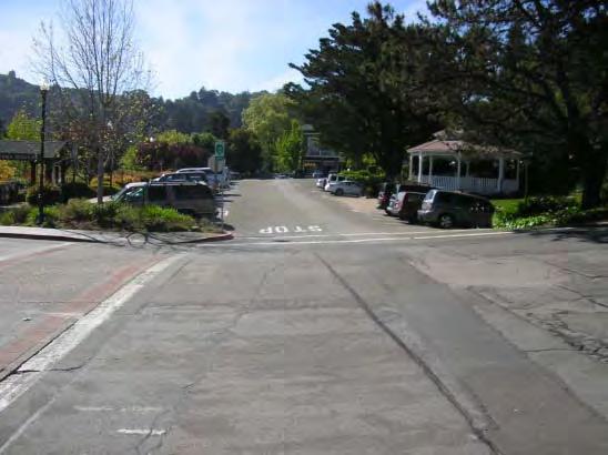 motorists and pedestrians and bicyclists using the crosswalk. The curbs could be extended across the bus lane to create enlarged bus stops.