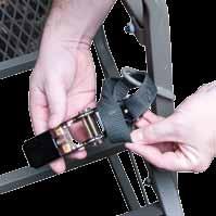 Attach the ratchet portion of the main strap to the bottom ladder column between the