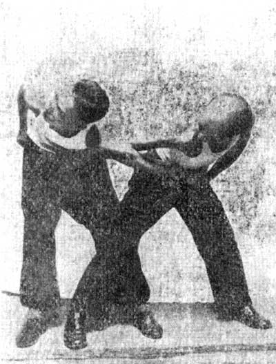 Paragraph 1 QIAN PENG ZHOU: Pressing on an elbow from the front. As to technique this method is similar to the method CUI ZHOU Fracturing an elbow (See section 4, paragraph 5, photo 34).