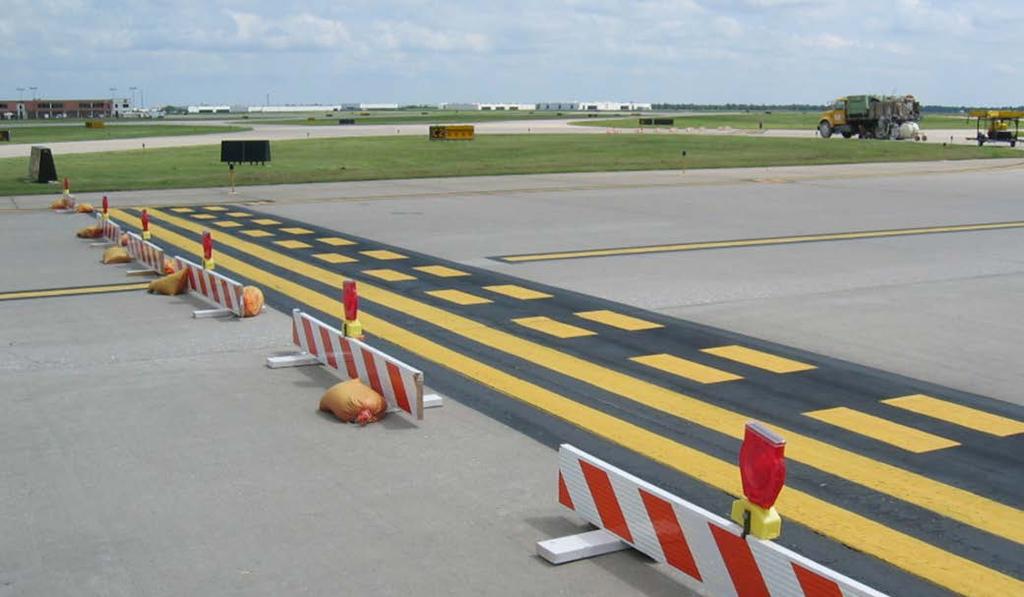 Unserviceability Markers/Lights Use highly reflective barriers with flashing or steady-burning red lights to barricade taxiways leading to closed runways.