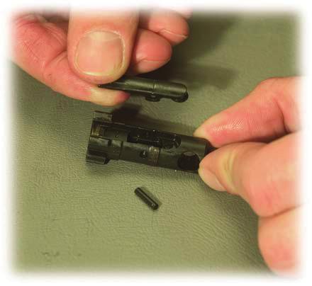 NOTE: Extractor assembly has a rubber insert within the spring. Be sure not to lose it.
