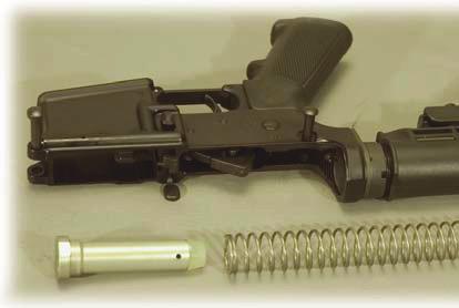 Then push the bolt carrier and charging handle all the way forward un l the bolt carrier is