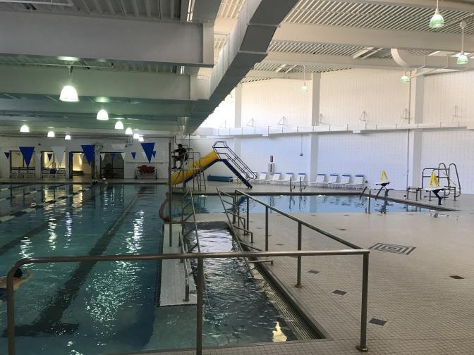 Accessibility Patron access to the existing pools is limited. A limited ramp, wall-mounted stairs and a pneumatic chair lift provides access to the existing pool.