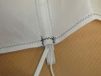 Bend the strap in half and insert the end in the batten pocket. 4.