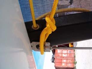 3 Take the righting rope ( mm yellow rope in the rope bag) and pass it around the fixation of the dolphin striker under