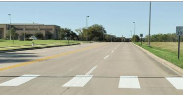 ADT is greater than 15,000 on roadways with four or more lanes and with a raised median or crossing island.