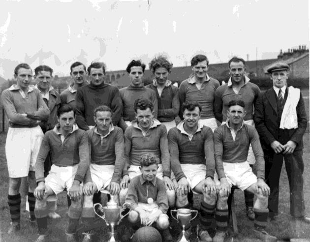 Galgate in 1949-50 pictured with the Senior Challenge Cup won by beating Carnforth Rangers 2-1 and the Parkinson Cup won by beating Bolton-le-Sands 5-2 In Front: J M Bigrigg, W