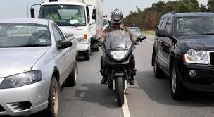 Riding between rows of stopped or moving vehicles in the same lane can leave you vulnerable.
