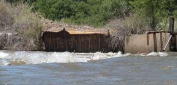 This 2 foot tall junky dam is frequently run on the far left. To avoid rebar punctures, line your boats on river left.