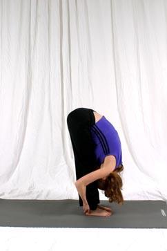 Forward Fold Stand to the side of your student Place one hand on their sacrum for stability and place your other hand in the middle of their back (between the lower parts of the shoulder blades).