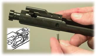 NOTE: In the cutaway drawing, the firing pin retaining pin sits behind the large shoulder of the firing pin.