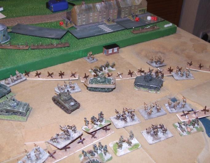 Despite the tanks failings more infantry do reach the sea wall and those there start to put suppressing fire into the German positions. Elements of Baker company climb the wall and.