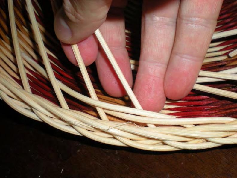 5. Fifth rim row: on the inside of the basket take each spoke over two spokes and down.