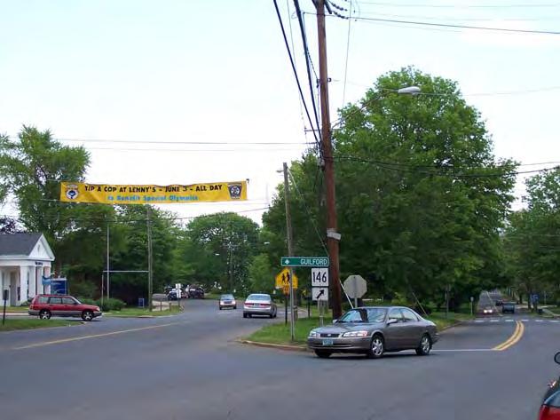 Intersection of Main Street at South Main Street & Laurel Street Channelizing Island (Board #10): At many arterial street intersections, pedestrians have difficulty crossing due to right-turn