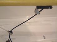 Once the boat is in the water, loosen the lock nut on the rudder head, pull the line firmly tight and to check the