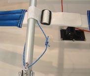 This picture shows the vang (blue), and the c/b downhaul (red), sharing the deckstrap under