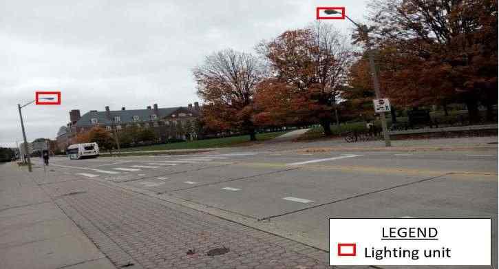 Figure E-24 shows the mid-block crosswalk treatment at Gregory Dr. Figure E-24. Mid-block crossing along Gregory Dr., near David Kinley Hall at the University of Illinois. E.2.1.1.3.