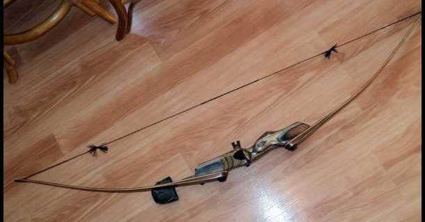 recurved and the string rests on the limbs, so it would not be allowed in the Longbow class.