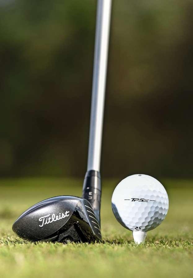 HYBRID: HALF THE BALL SHOWING Tee the ball so half of it is visible above the crown of the club.