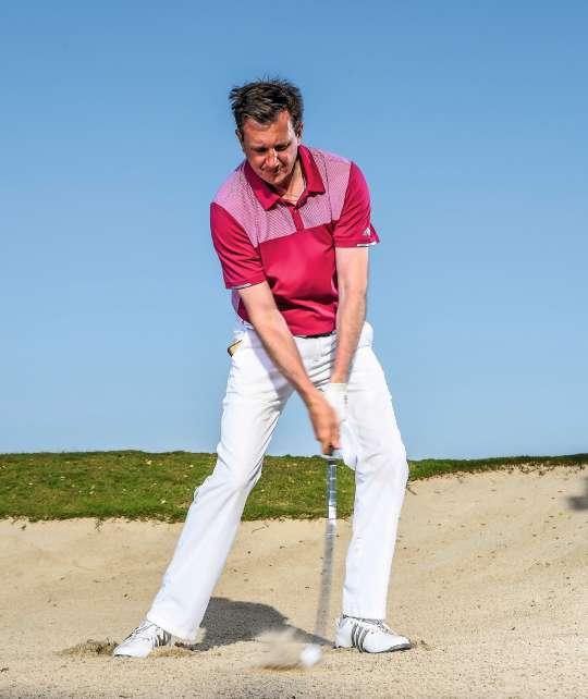 BACKSWING: SHARPER WRIST COCK To apply clubface loft to the sand, we need the wrists to cock and then release coming into impact.