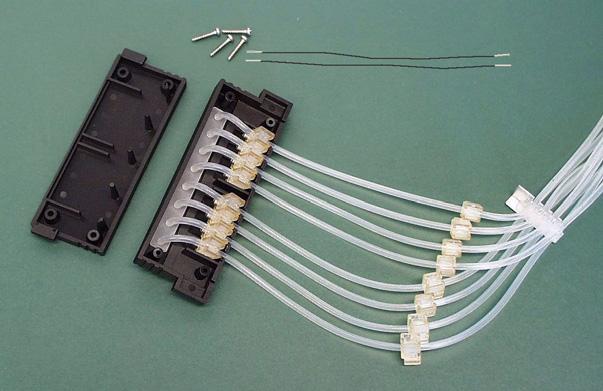 Attach the tension limiting wires into their slots (Figure 5 32). Slots for tension limiting wires Figure 5 32.