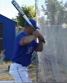He will avoid striking the fence with his bat by keeping the front elbow slightly