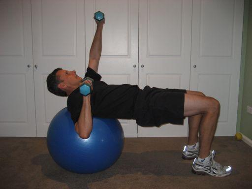 The golfer presses the dumbbells towards the roof, maintaining the posture of the hips and trunk at all times 2.