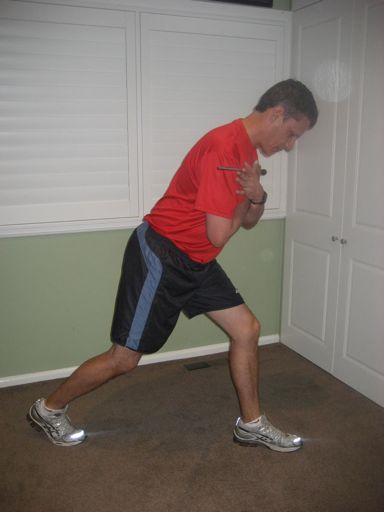 golfer holds this position for 3 seconds, keeping their hips level and