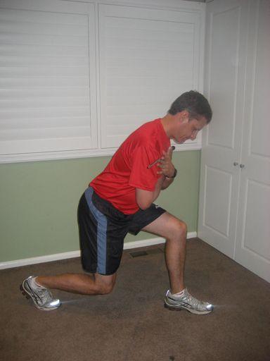 Weighted Golf Posture Lunge The golfer stands in lunge position and bends