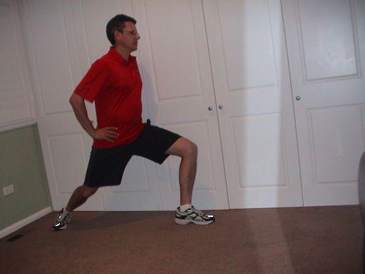 Arabesque Squat The golfer stands on 1 leg, arms out to