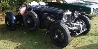 Julian Bronson Talk 9th February By Tim Murray Julian started his talk by contrasting his rather short lived racing debut at the age of sixteen in an ancient Hillman Minx, to his current position