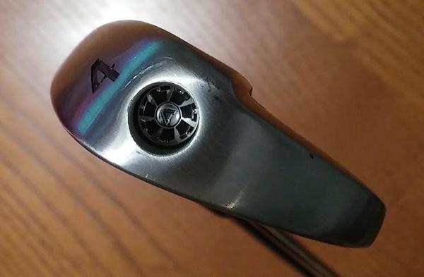 The nitrogen cartridge outlet is visible on the outer toe of the 3 & 4 iron.