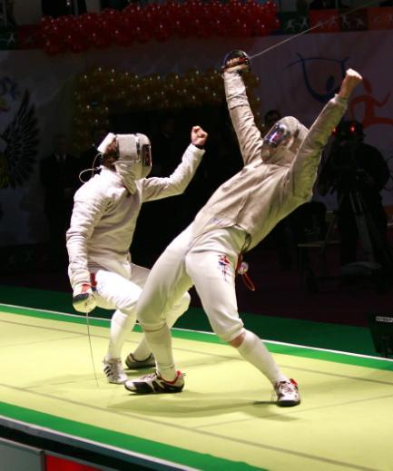 fencers uniform includes a metallic jacket (lamé), which fully covers the target area to register a valid touch on the scoring machine.