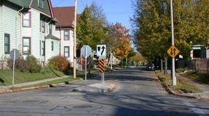-Install a raised curb median at entrance to residential street that meets a higher volume street -Can be used as neighborhood gateway on wider streets $5K-$15K Entry Median -Reduce non-local