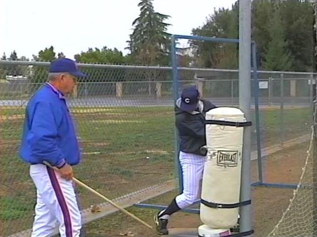 Practice hitting the outside pitch by moving forward, so the bat makes contact with the bag at back part of the hitting zone.